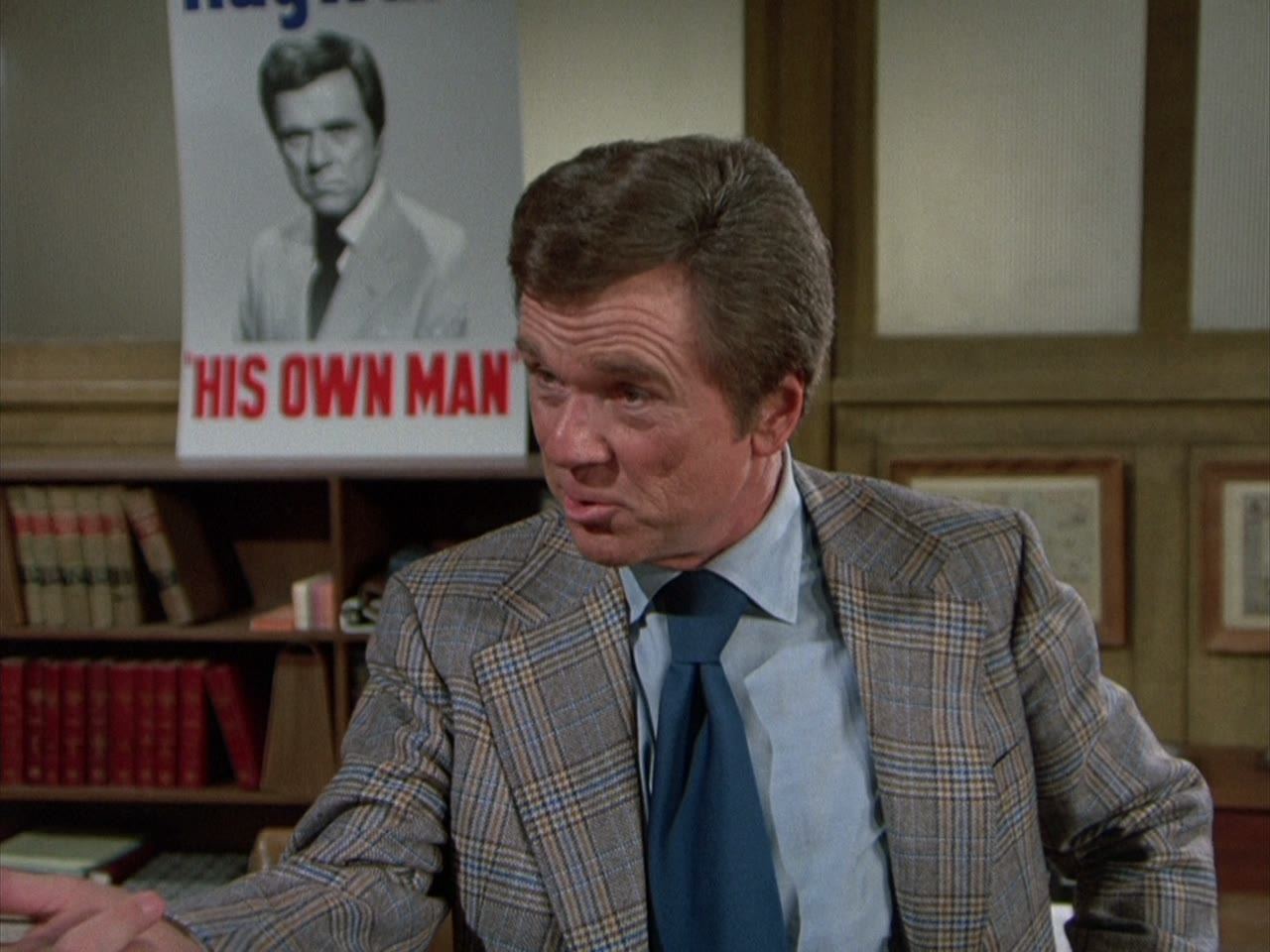 Nelson Hayward in front of his own poster: “his own man”