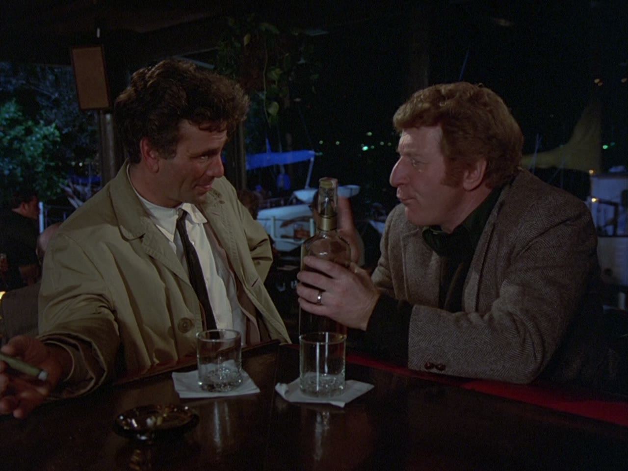 Two men at a bar, each knowing exactly why he is there