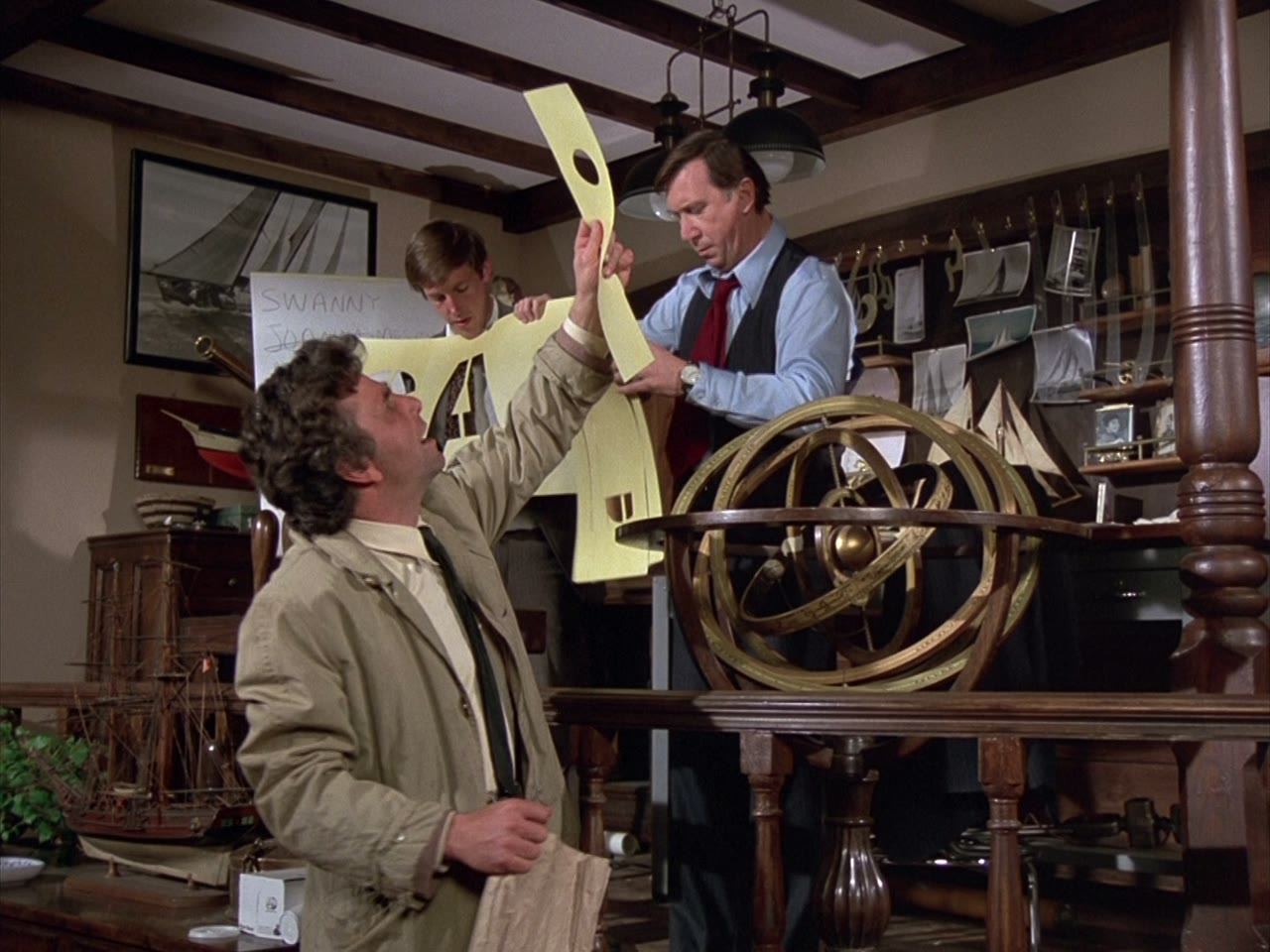 The lieutenant studies the ship's wheel longer than any clue