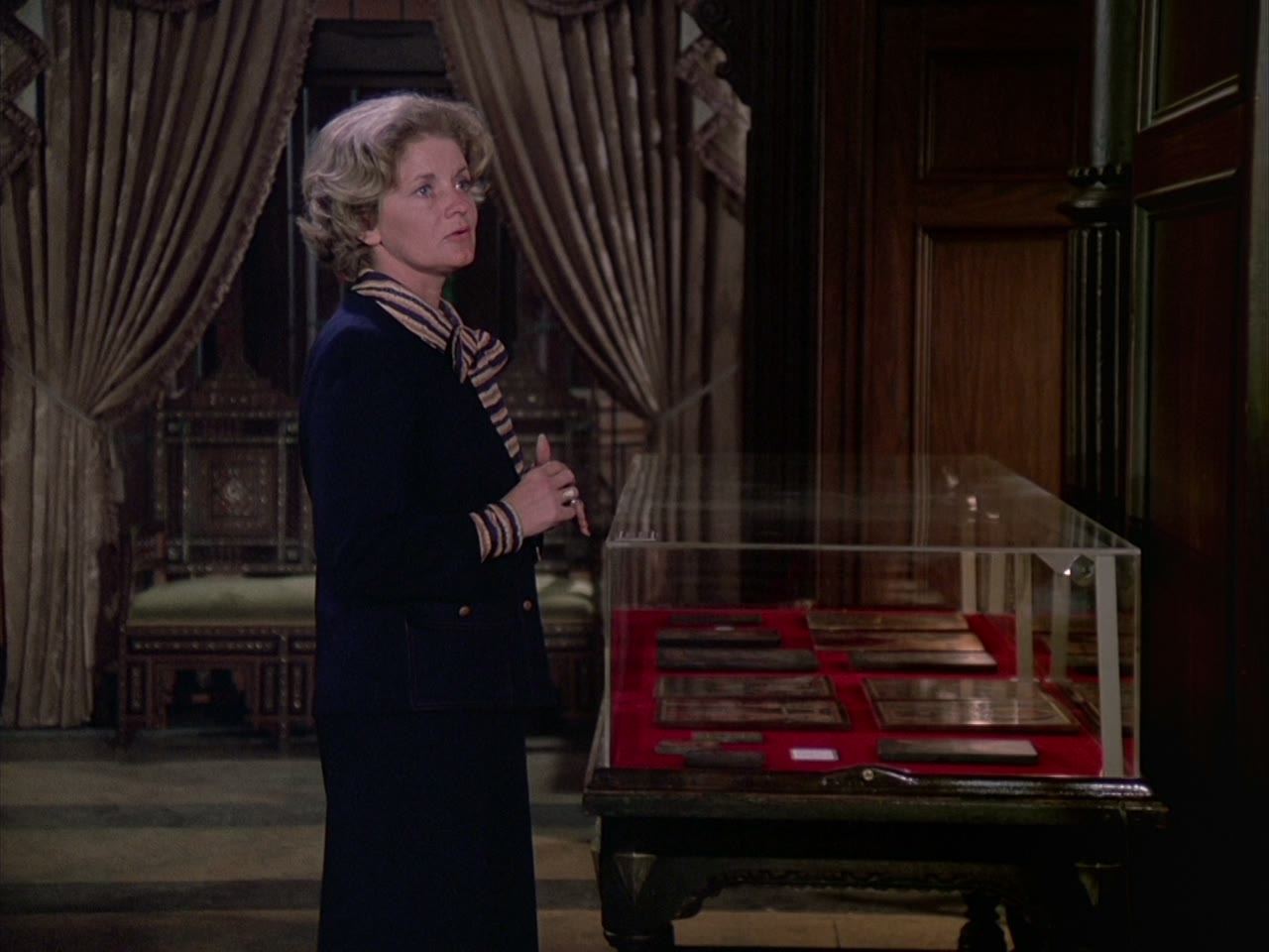 The owner beside the case she knows everything about