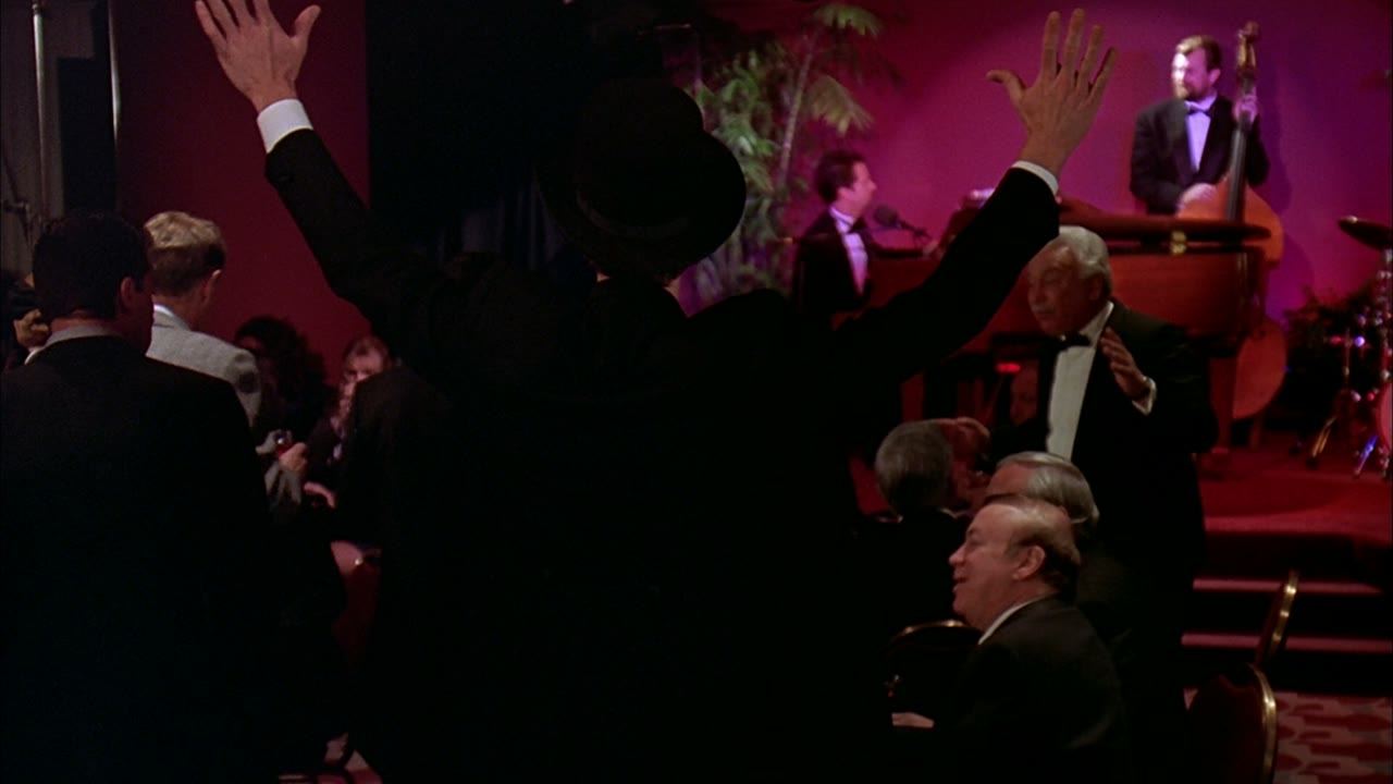 A farewell that people attend with cameras